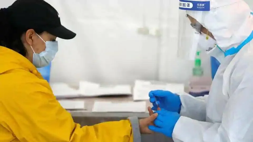 A healthcare worker performs a coronavirus antibody test at a SOMOS Community Care COVID-19 antibody walk-in testing site during the outbreak of the coronavirus disease (COVID-19) in Brooklyn, New York City.