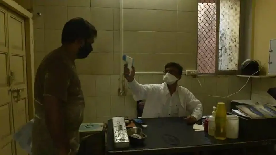 Mumbai, India - 18 May 2020: BMC clinic doctor doing thermal checking at BMC clinic, Worli Village in Mumbai, India, on Monday, May 18, 2020. (Photo by Pramod Thakur/ Hindustan Times)