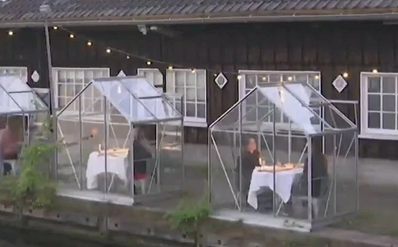 Dutch restaurant trials glass booths for dining amid coronavirus