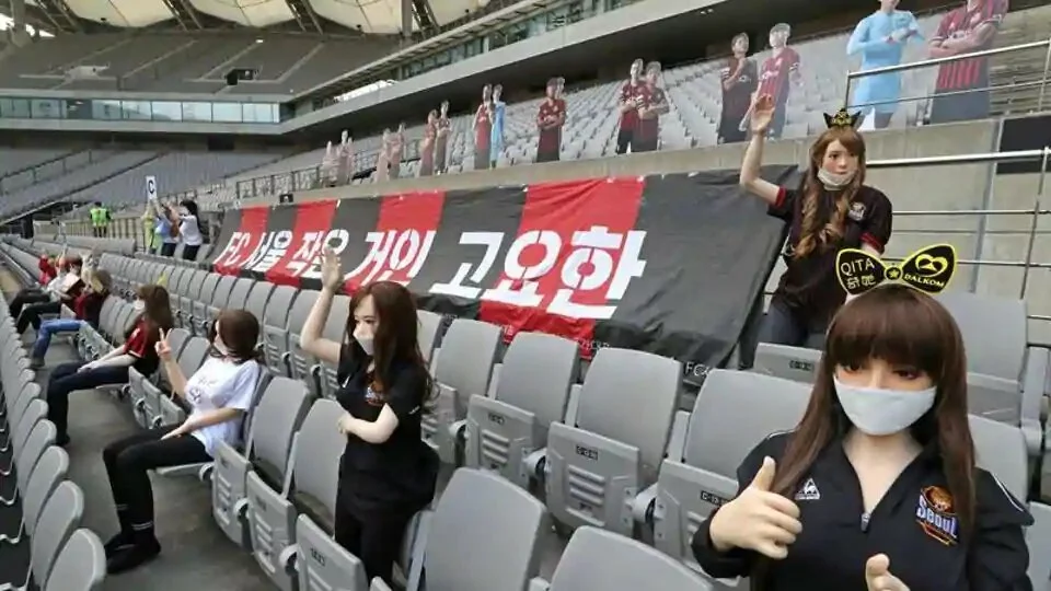 Mannequins are placed in spectator seats to cheer South Korea