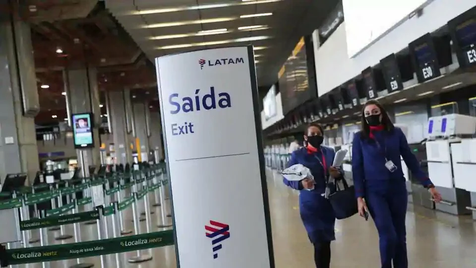 Latam Airlines employees walk at the company