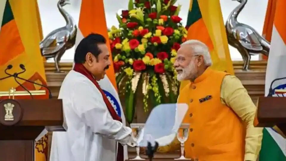 Prime Minister Narendra Modi (R) shakes hands with Sri Lankan Prime Minister Mahinda Rajapaksa after a joint statement at Hyderabad House, in New Delhi.