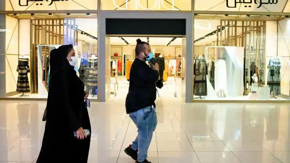 Pedestrians wear protective face masks while visiting a shopping mall and open retail stores in Riyadh, Saudi Arabia, on Tuesday, May 19. 2020. Before the pandemic, most shops, pharmacies and gas stations in the kingdom halted for at least 30 minutes for each prayer session, the only country that enforced such closures.