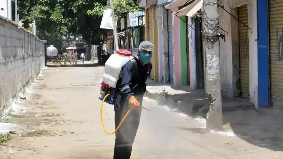 A civic woker chemically disinfects an area near the Dankaur station, in Greater Noida, Uttar Pradesh, Saturday, May 16, 2020.