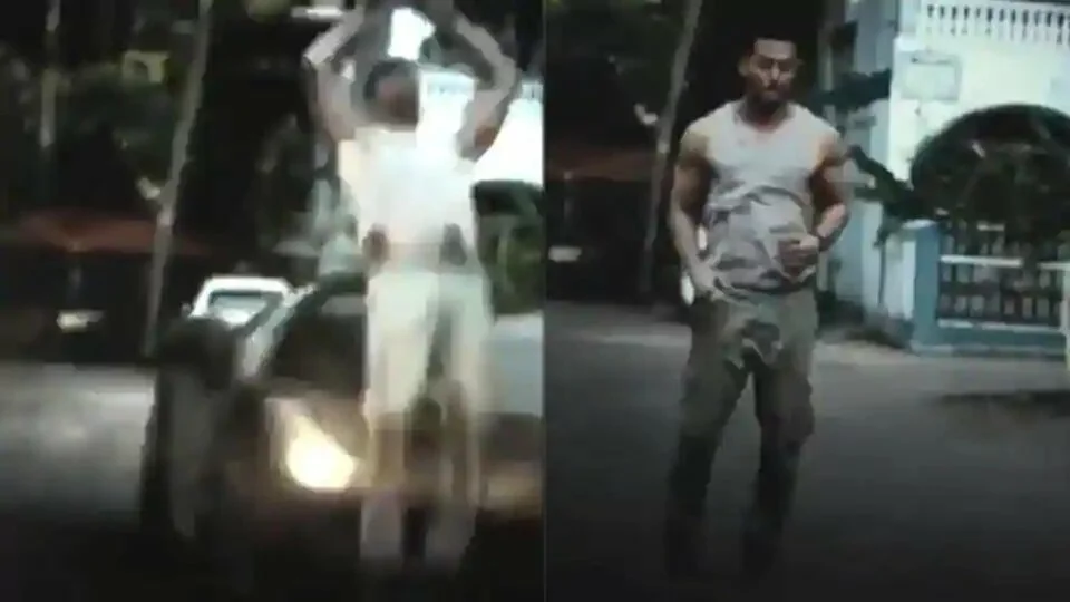 Tiger Shroff does a backflip on the road.