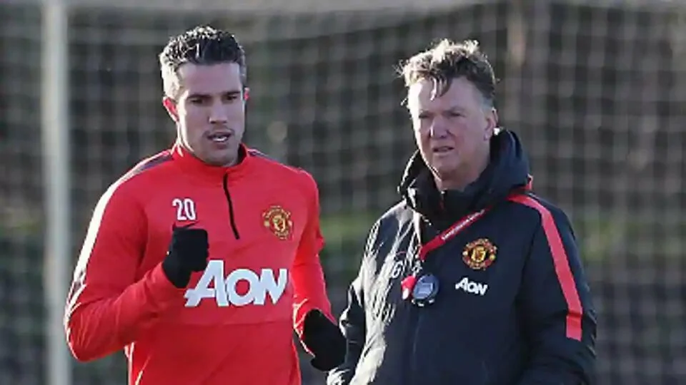 Robin van Persie and Manager Louis van Gaal of Manchester United during a first team training session