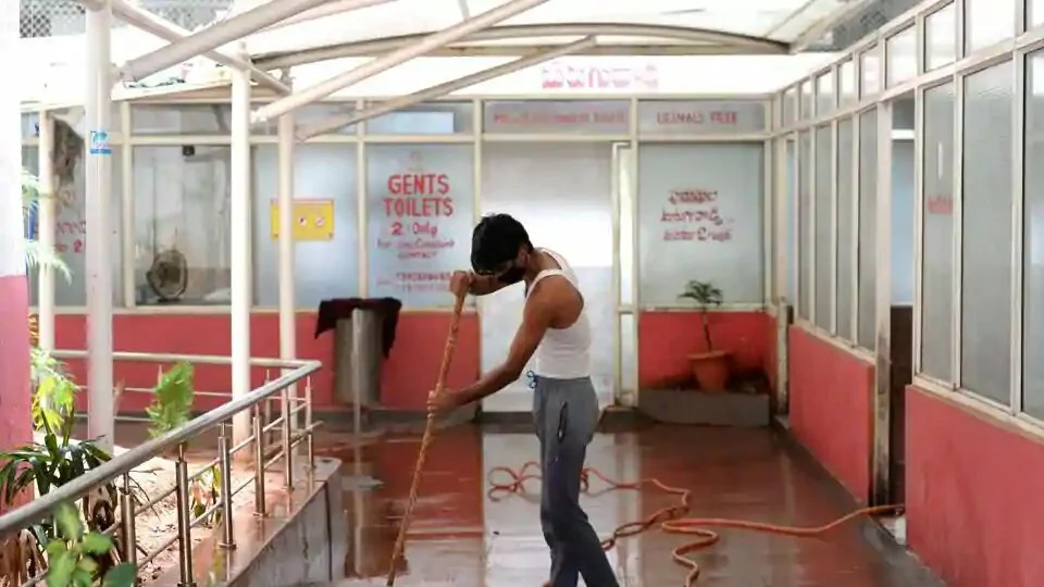 A worker cleans toilets at a bus station in Telangana, on Tuesday.