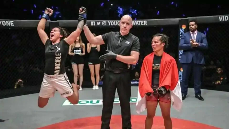 Puja Tomar after her victory over Priscilla Hertati Lumbangol .