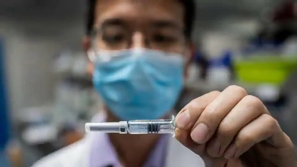 An engineer displaying an experimental vaccine for the Covid-19 coronavirus that was tested at the Quality Control Laboratory at the Sinovac Biotech facilities in Beijing.