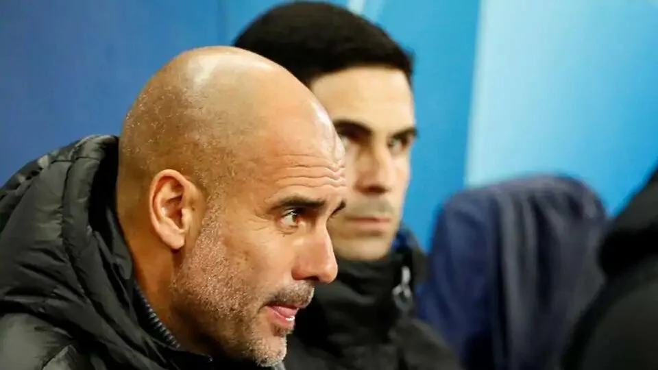FILE PHOTO: Soccer Football - Champions League - Group C - Manchester City v Shakhtar Donetsk - Etihad Stadium, Manchester, Britain - November 26, 2019 Manchester City manager Pep Guardiola and assistant coach Mikel Arteta before the match Action Images via Reuters/Jason Cairnduff/File Photo