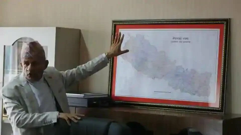 Nepal’s foreign minister Pradeep Gyawali points to a map of Nepal in Kathmandu.