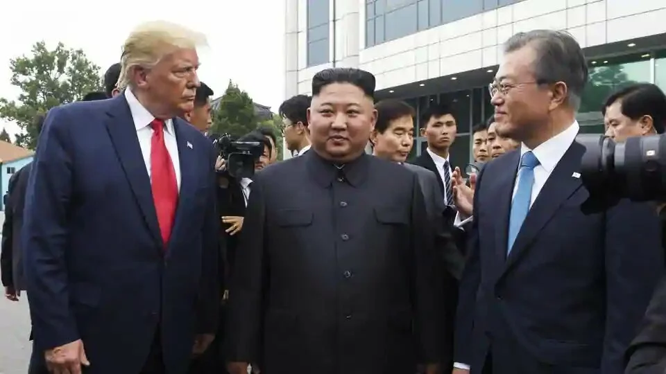 President Donald Trump, left, meets with North Korean leader Kim Jong Un and South Korean President Moon Jae-in, right, at the border village of Panmunjom in the Demilitarized Zone, South Korea on June 30, 2019.