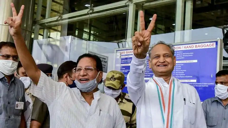 Rajasthan chief minister Ashok Gehlot and senior Congress leader Shanti Dhariwal flash victory sign at Jaipur Airport while moving party MLAs to Jaisalmer on July 31, 2020.
