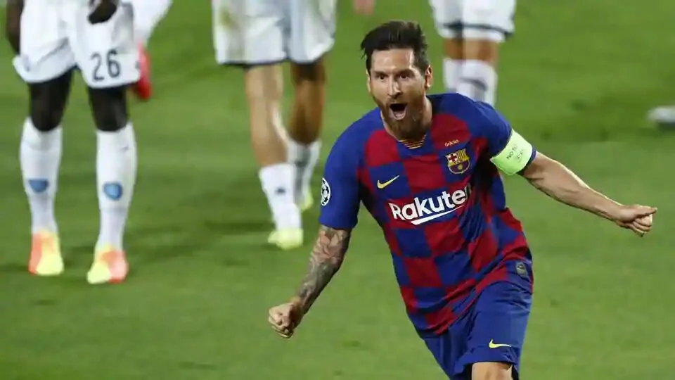 Lionel Messi celebrates after scoring his side’s second goal during the Champions League round of 16.