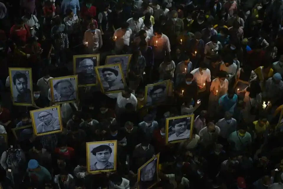 A large crowd, with several carrying portraits of Soumitra Chatterjee on Sunday, takes part in the funeral procession of the actor who passed away aged 85 in Kolkata.