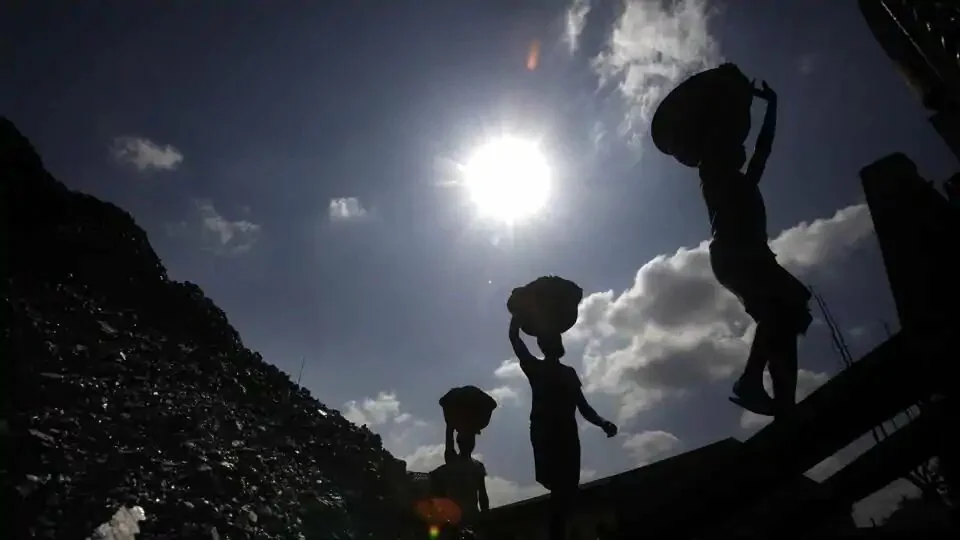 Laborers carry coal to load on a truck in Guwahati. The new rules state that no amendment will be required in the EC granted to the plant, even if the source of coal, and consequently, its distance from the thermal power plant changes.